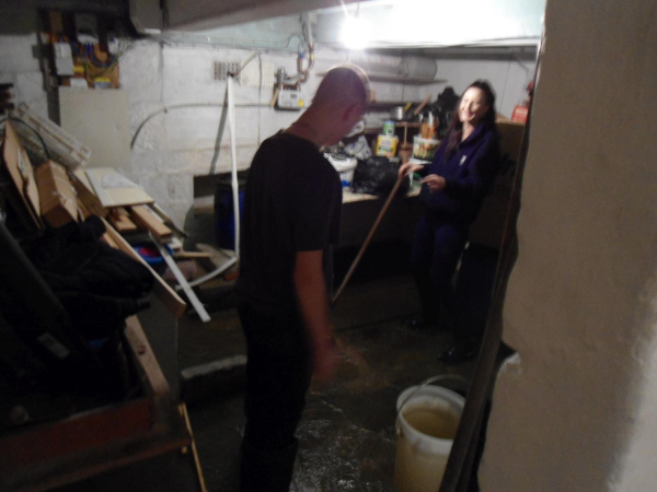 Mopping out Great-grandad's cellar after flood 12 BRW 
09-People and Family-02-People-000-General
Keywords: 2023