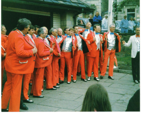 The Manchester Glee Club sing in Market Place 
17-Buildings and the Urban Environment-05-Street Scenes-017-Market Place
Keywords: 1990