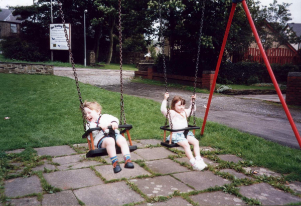 Children enjoy a swing on Edenfield's playground
17-Buildings and the Urban Environment-05-Street Scenes-011-Edenfield
Keywords: 1998