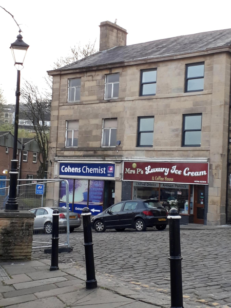 Cohen's Chemist & Mrs P's Ice Cream shop in Market Place 
17-Buildings and the Urban Environment-05-Street Scenes-017-Market Place
Keywords: 2019