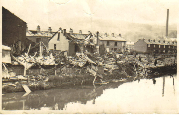 Stubbins 9th May 1941 from Chattertom lane after explosion of 1st landmine, early morning. Warwicks bungalow & wooden hut, (?) Pin meadow  (Scowcroft)
17-Buildings and the Urban Environment-05-Street Scenes-027-Stubbins Lane and Stubbins area
Keywords: 1945