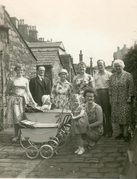 Hibbert family, 1961, back of Callender Street. Shows baby in pram, & matching dolls pram.
09 - People and Family - 01 - Families
Keywords: Bury-Archive