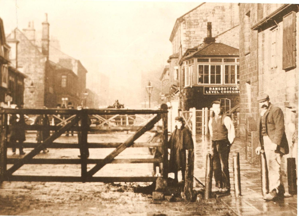 Toll Bar, Bridge Street, Ramsbottom showing workmen and closed level crossing gates c1900 
16 - Transport - 01 - Car and Roads
Keywords: Bury-Archive